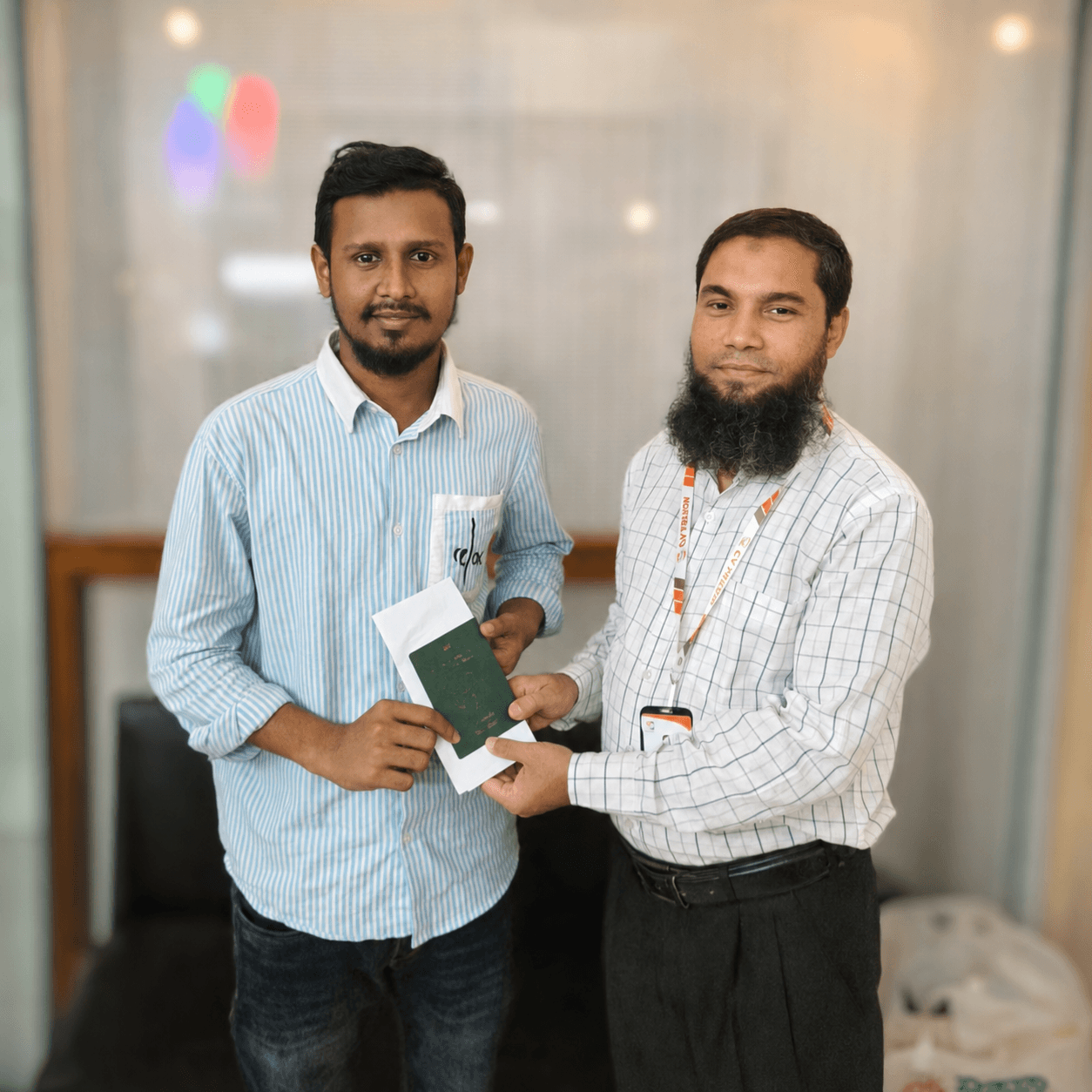 CV Felow advisor handing an approved passport and visa letter to a client
