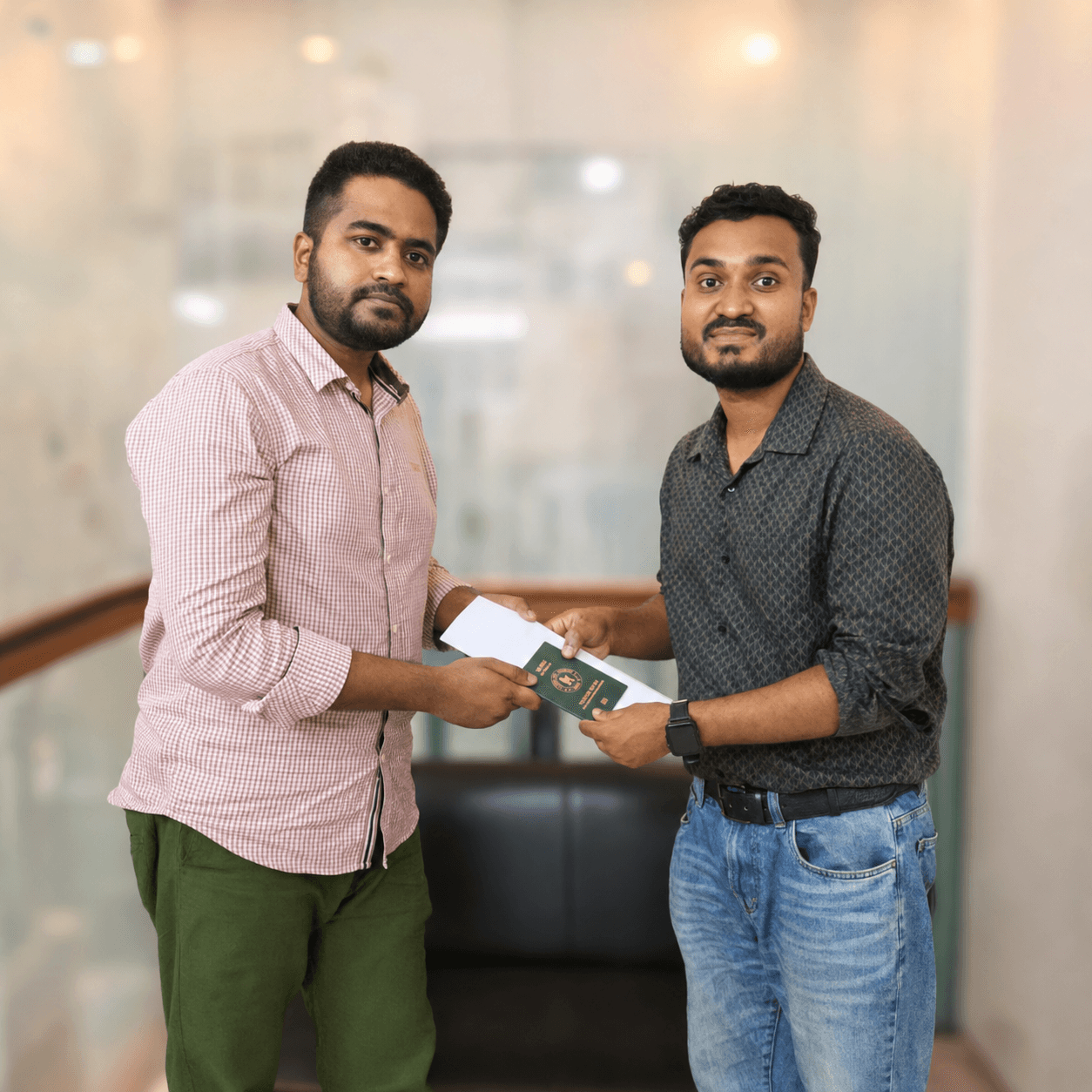 CV Felow client receiving approved travel documents from a second person