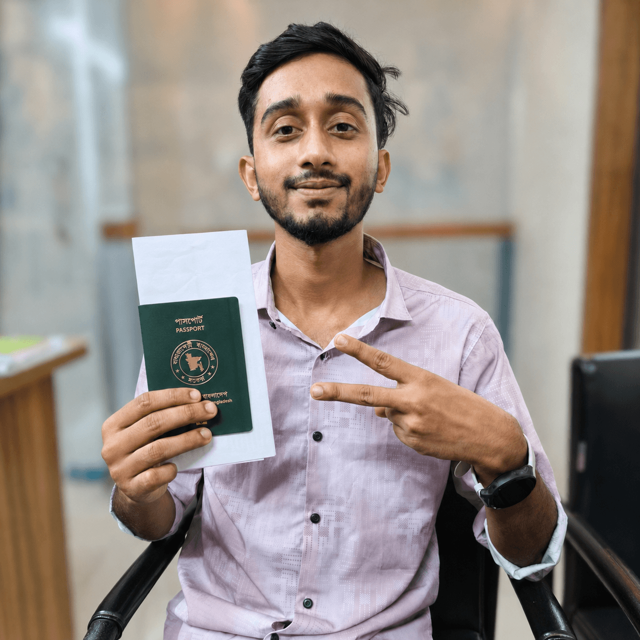 CV Felow client holding an approved passport and visa letter at the office